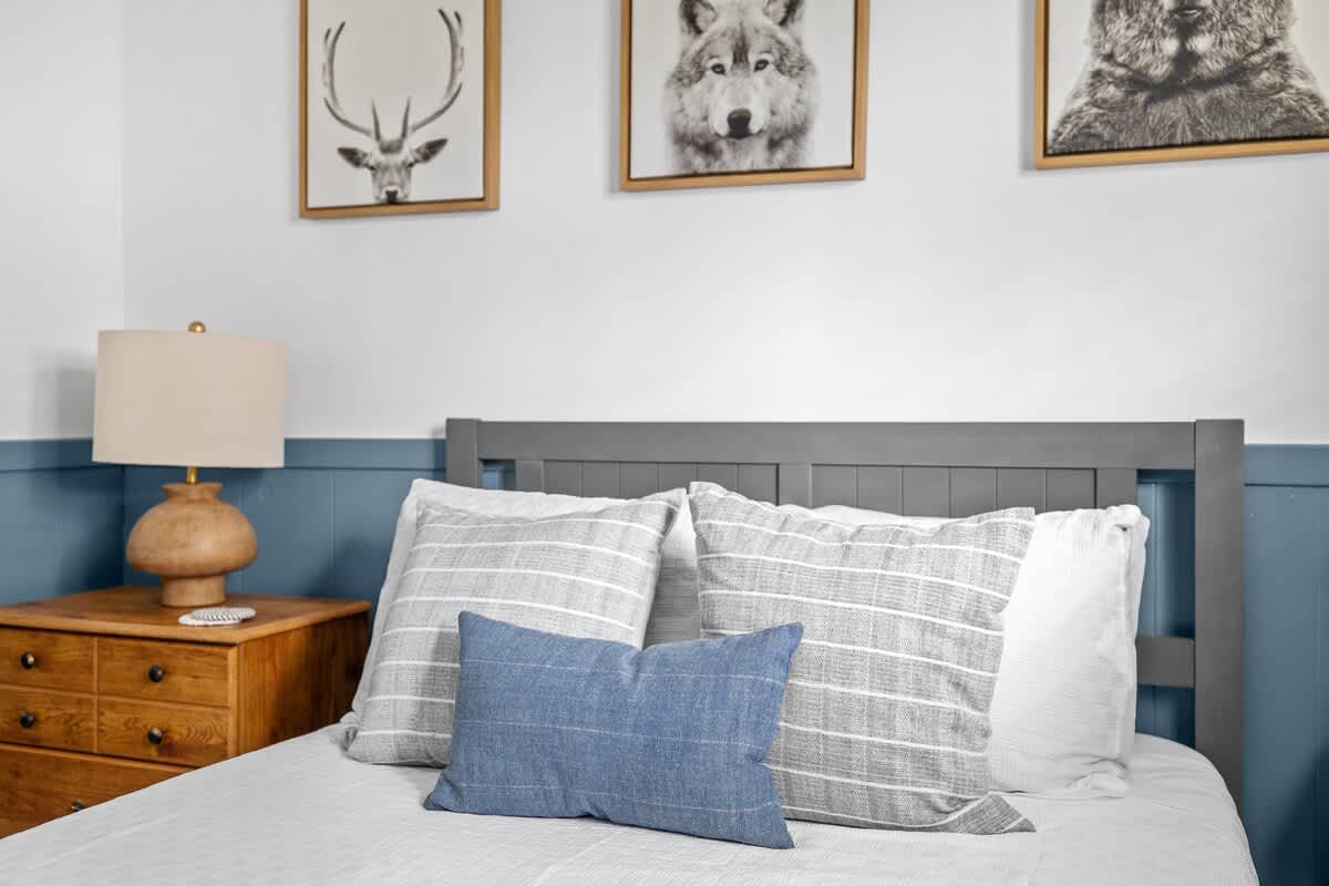 Rustic charm meets refined comfort in this inviting bedroom retreat.