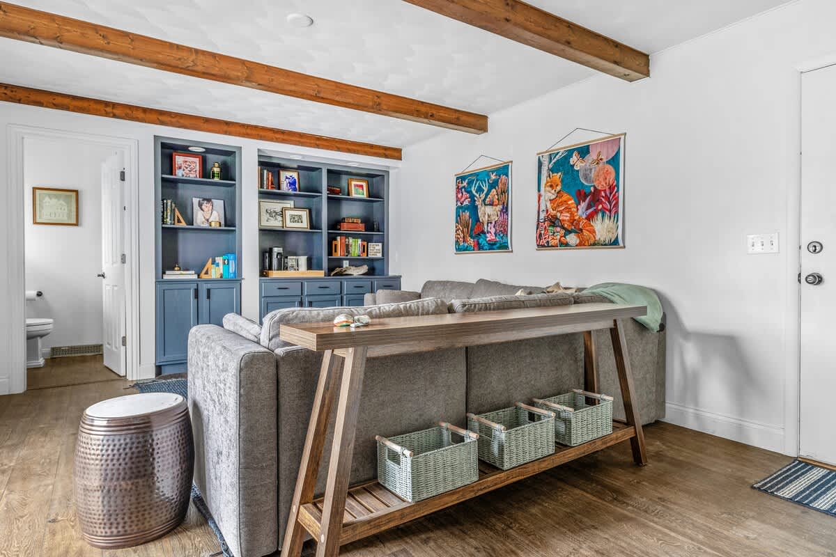 Stylish and spacious living with artistic vibes. The perfect space for game nights or a quiet escape.