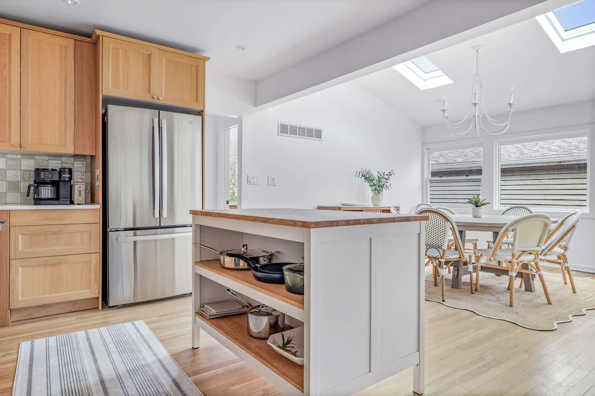 Bright mornings start here! Brew coffee, soak in the sun under skylights, and gather ‘round for slow breakfasts in sunlit, stylish kitchen + dining nook.