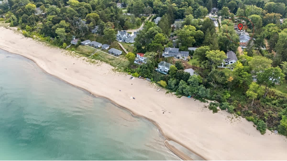 Steps to the beach! Beachside retreat surrounded by lush trees and colorful blooms.