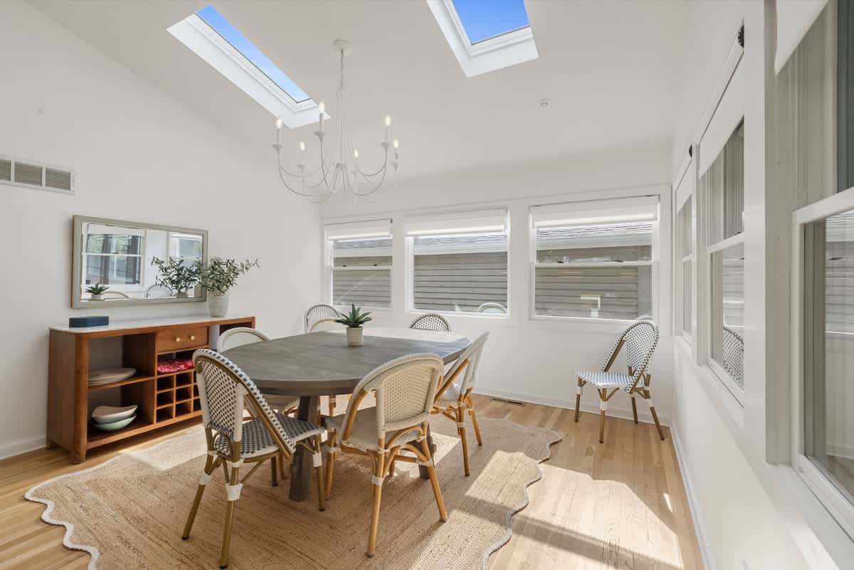 Gather, laugh, and linger longer in this sun-kissed dining room. Where refined charm meets natural light and every meal feels like a celebration!