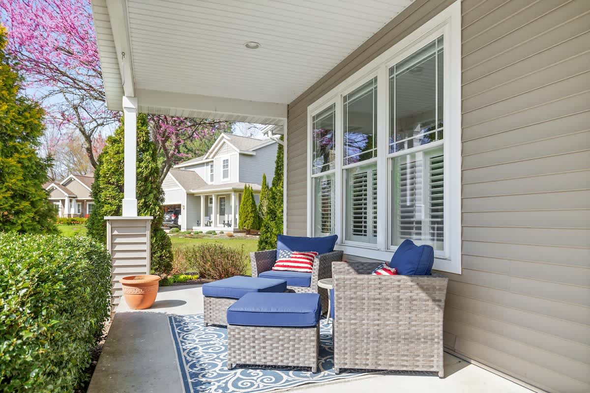 Relax in style with breezy seating and peaceful neighborhood views.