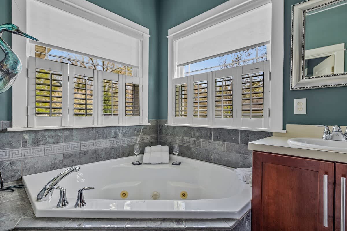 Deep soaking tub, sunlit views, and total relaxation on tap.