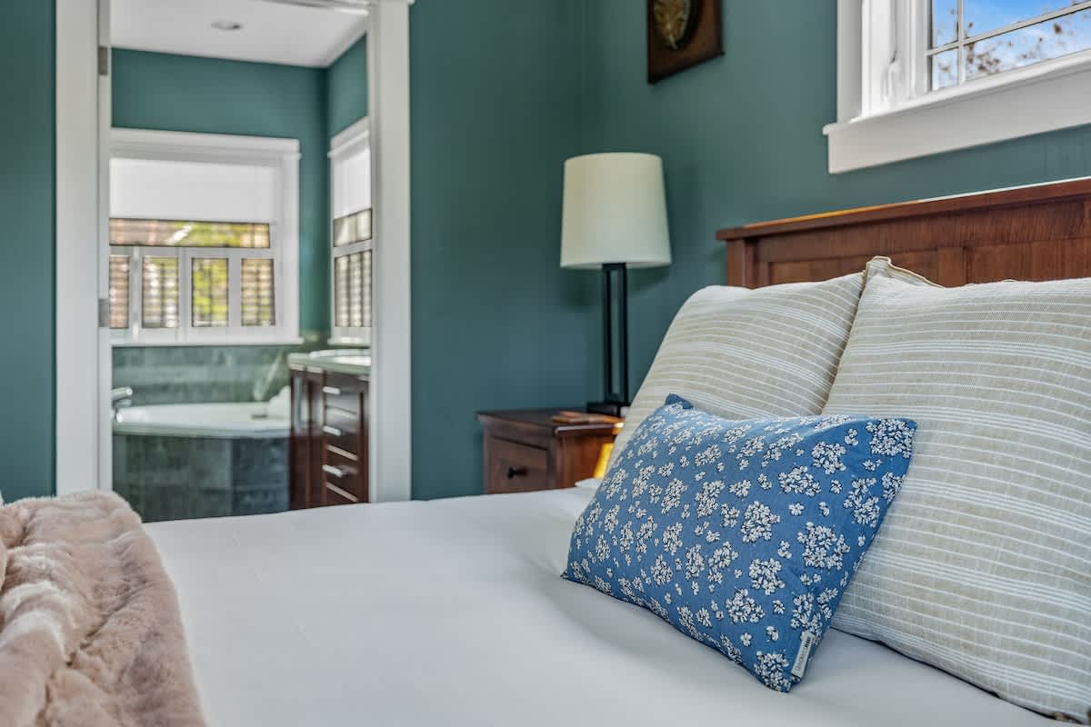 Soft sheets, bold walls, and a bathroom you don’t have to share—score!