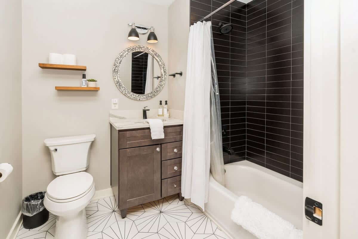Soothing tones, bold tile, and a tub made for relaxing.