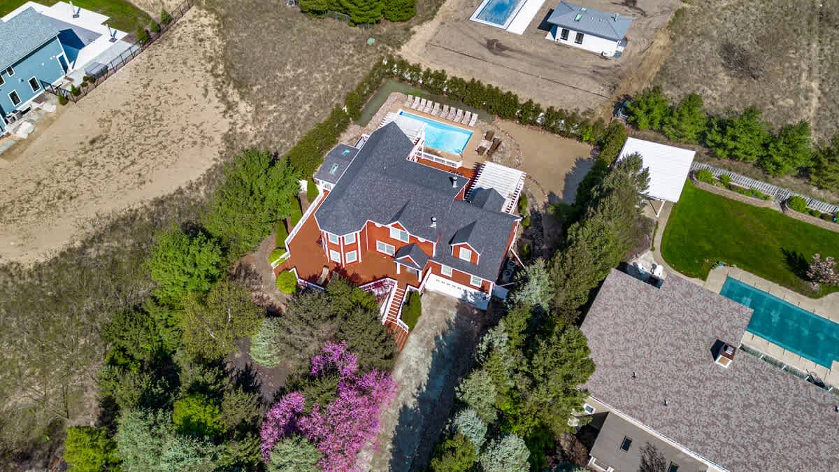 From tree-lined drives to poolside afternoons, this one-of-a-kind home is a memory-making haven.