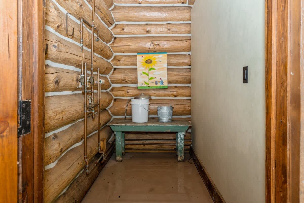 Buckets, benches, and backwoods charm in the cabana.