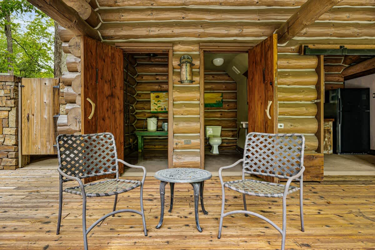 Two cozy chairs and a table make every sunset a cherished memory.