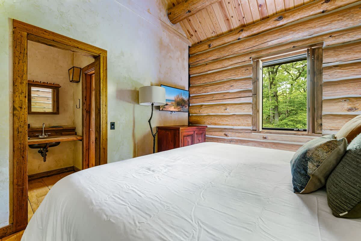 A king bed and inspiring views make this bedroom pure luxury living.