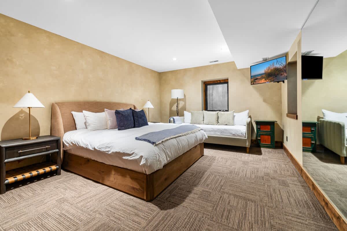 Bedroom 5 is on the lower level & has a queen bed and a daybed.