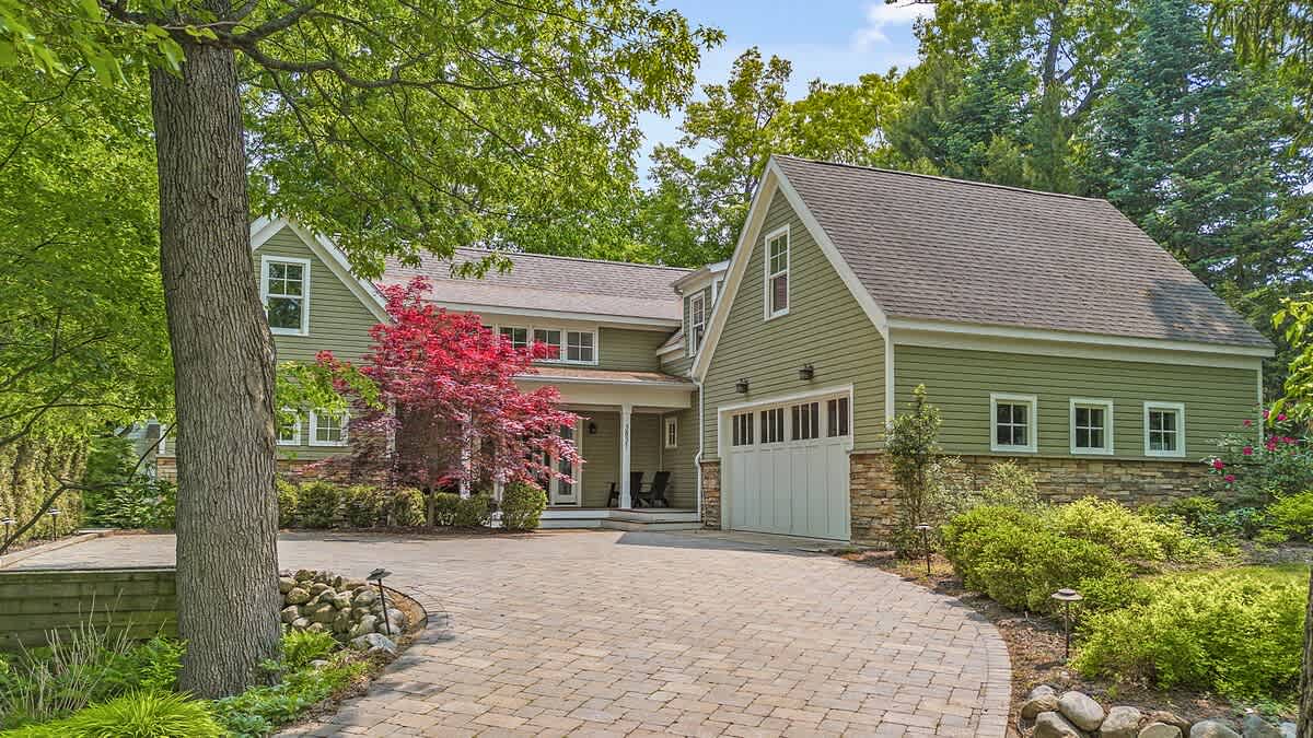 Stonework, symmetry, and serene curb appeal.