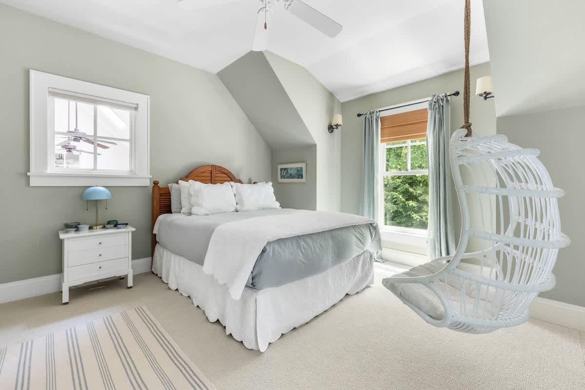 Swing into relaxation in this comfort bedroom with a playful twist.