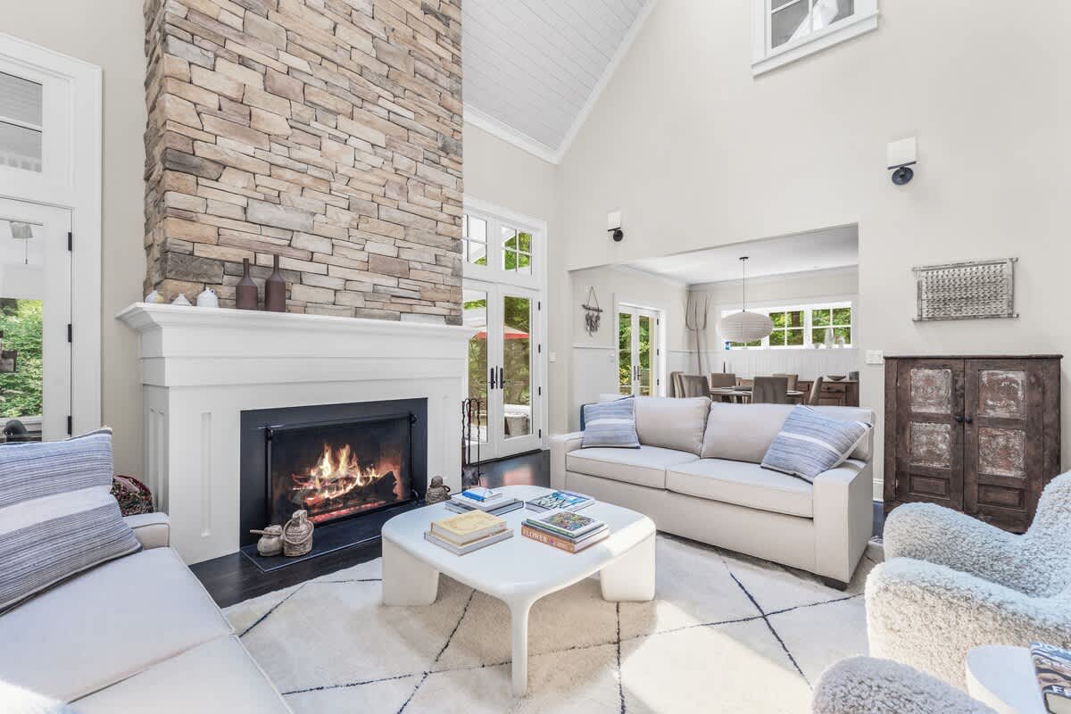 Luxe textures, lofty ceilings, and that cozy crackling fire.