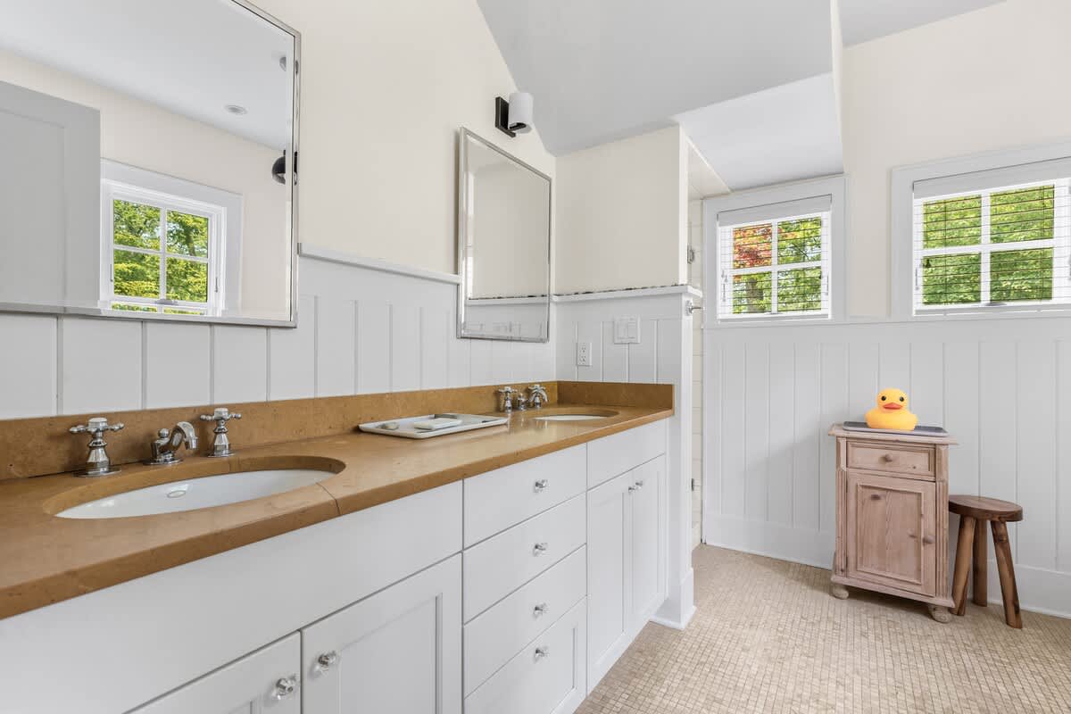 Double vanities, natural light, and one happy little duck.