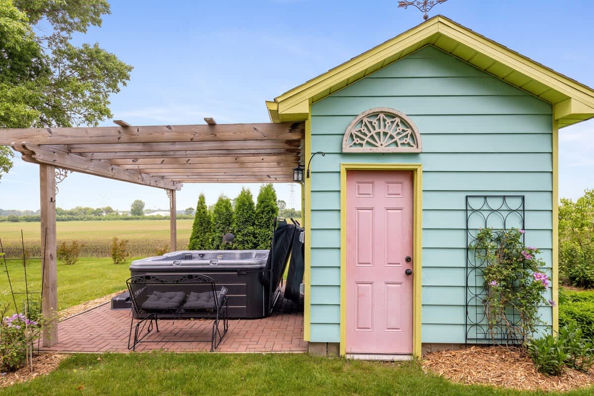 Soak in style beside the cutest pastel shed in the Midwest.