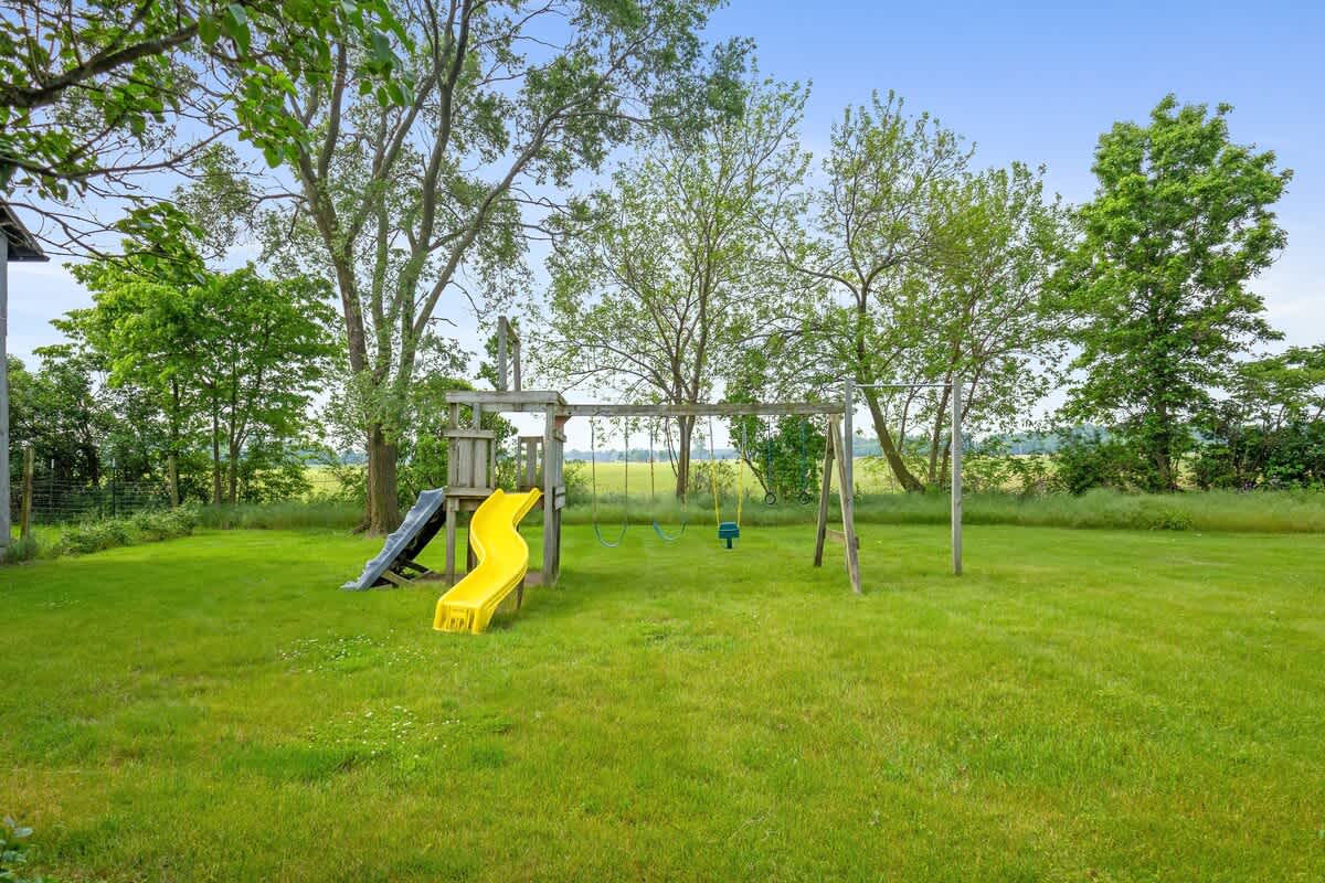 A kid-friendly paradise with swings, slides, and space to roam.