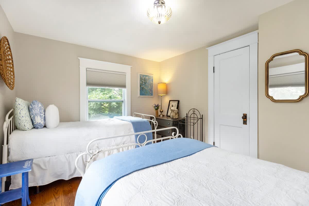 Sweet twin beds, soft blues, and vintage charm throughout.