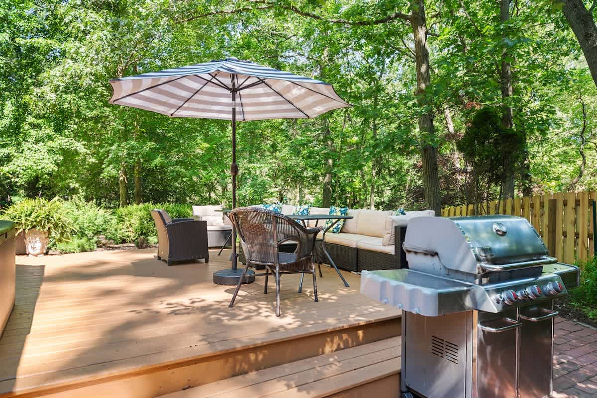 Dine, lounge, and soak up the sun in your private forest deck.