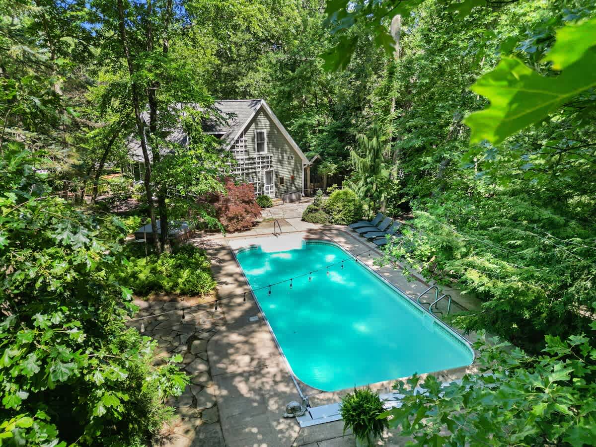 Welcome to Oasis in the Woods—your secluded spa + pool escape.