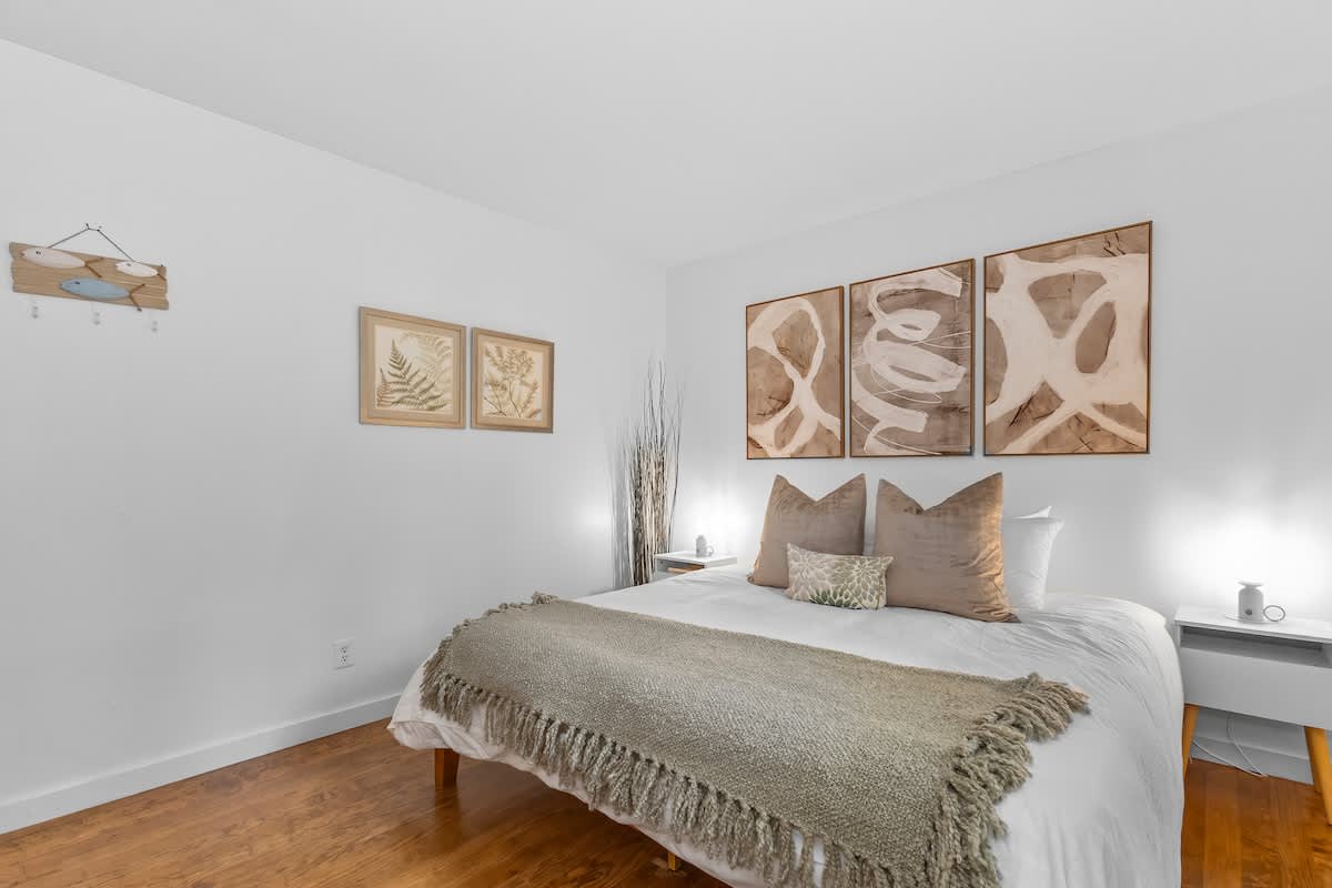 The primary bedroom is on the main level has a king-sized bed.
