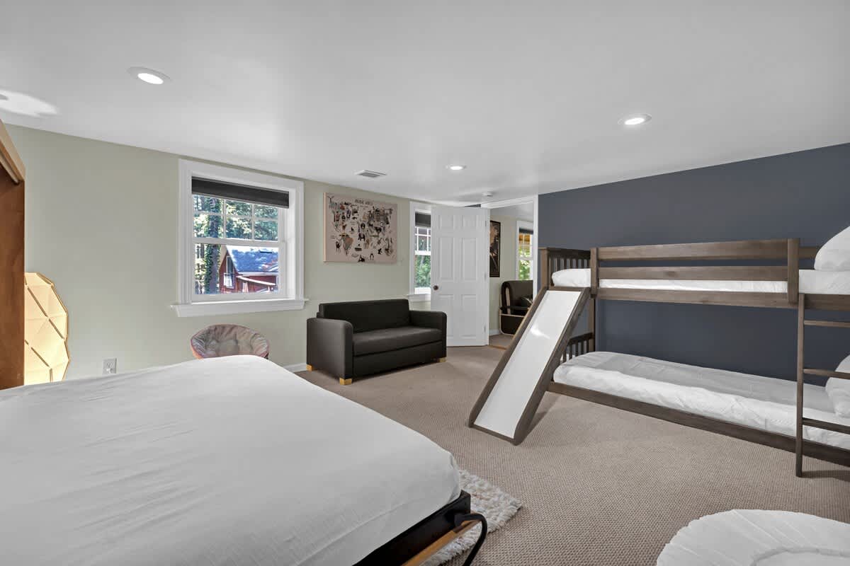 The ultimate kids’ zone—slide, bunks, and room to play.