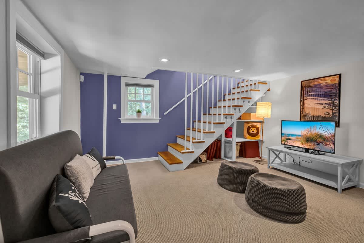 A fun lower-level hangout with TV, games, and bold color.