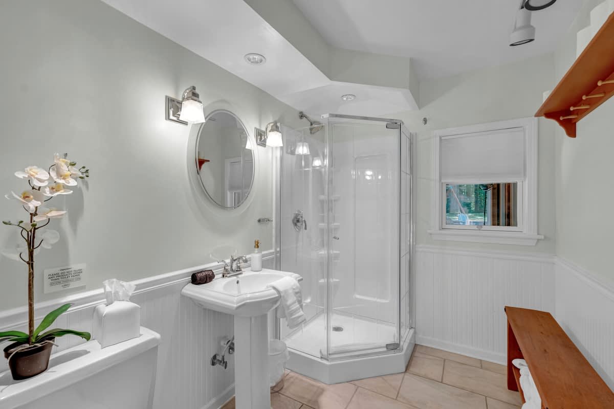 A spa-fresh bathroom with light, style, and a walk-in shower.