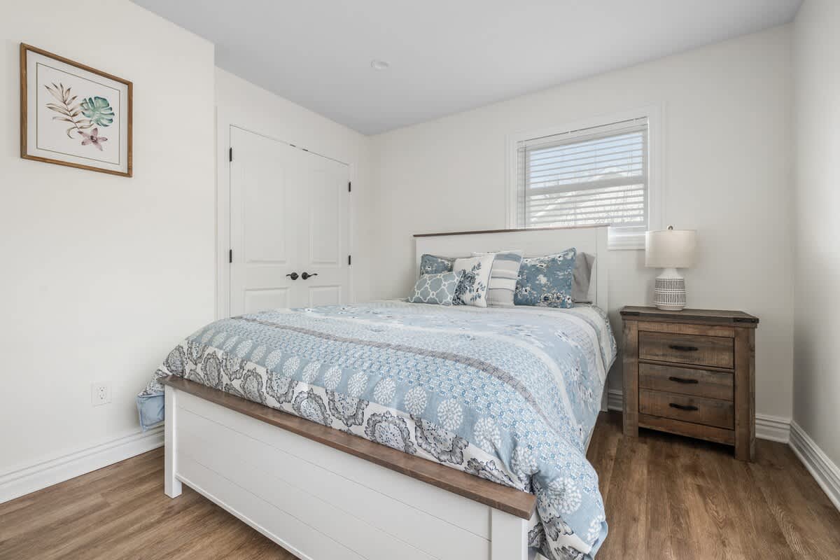 The primary bedroom is on the main level & has a queen sized bed.