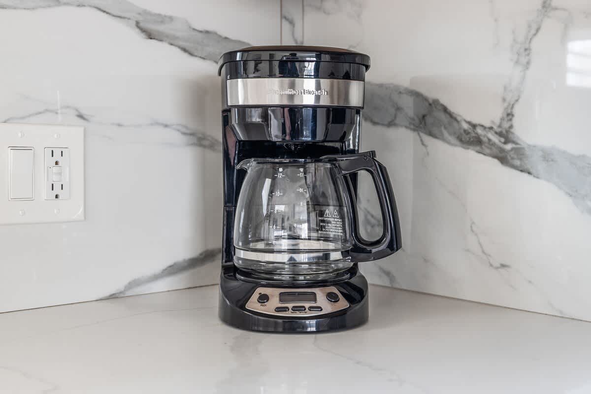 Your morning savior, standing by with a fresh pot and zero judgment.