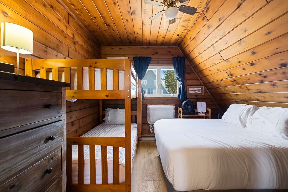 Bedroom 1 is on the upper level and has a queen-size + a single bunkbed.