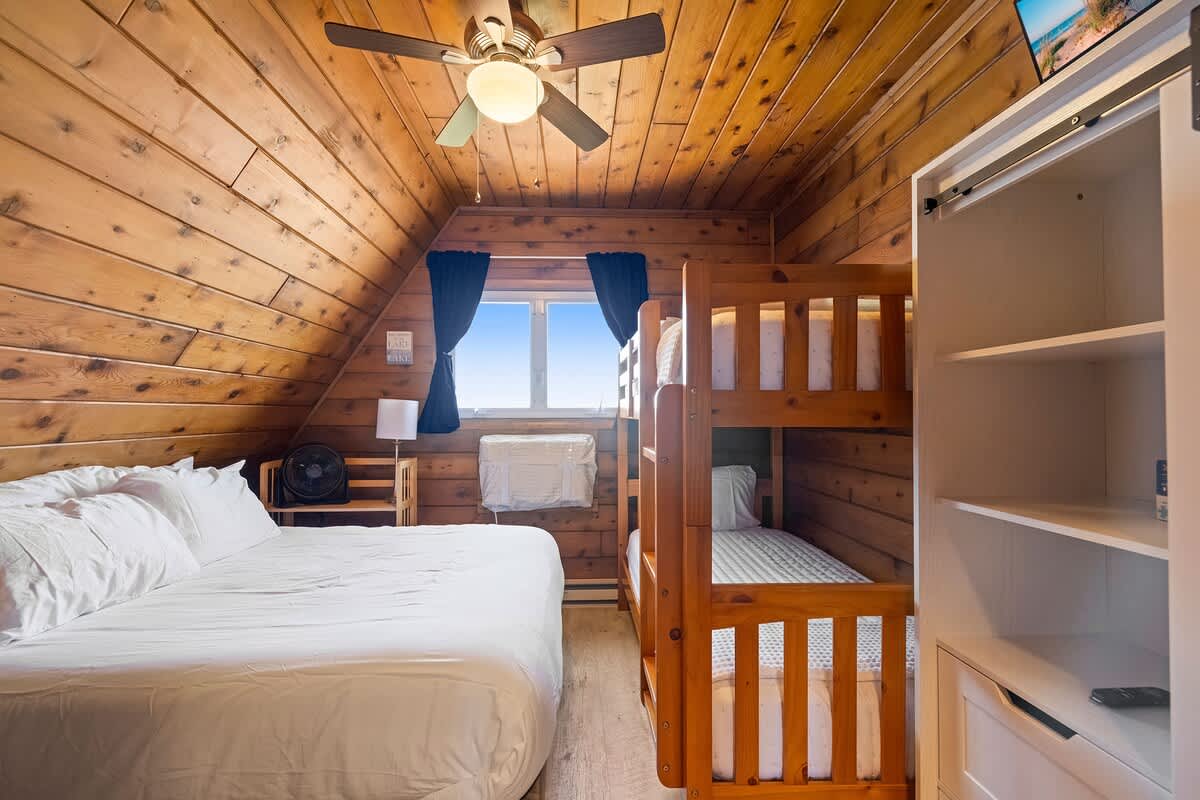 Bedroom 2 is on the upper level and has a queen-size + a single bunkbed.