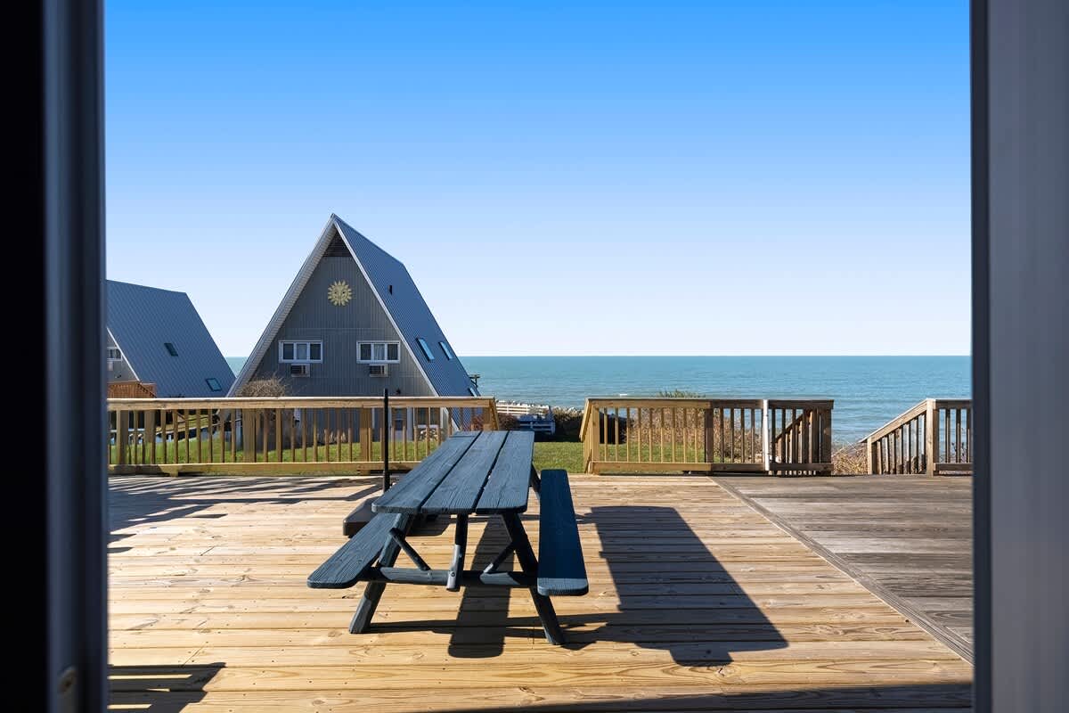 Dine al fresco and enjoy endless lake horizons from Leila's deck.