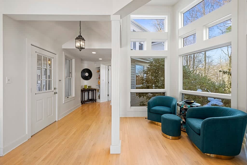 The Farmhouse entry opens into a warm, light-filled corner for relaxing.