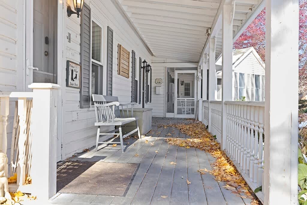 The Farmhouse porch invites you to linger, breathe, and unwind.