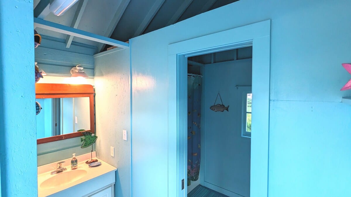 Get pool-ready or wash up in this playful, ocean-inspired bathroom.