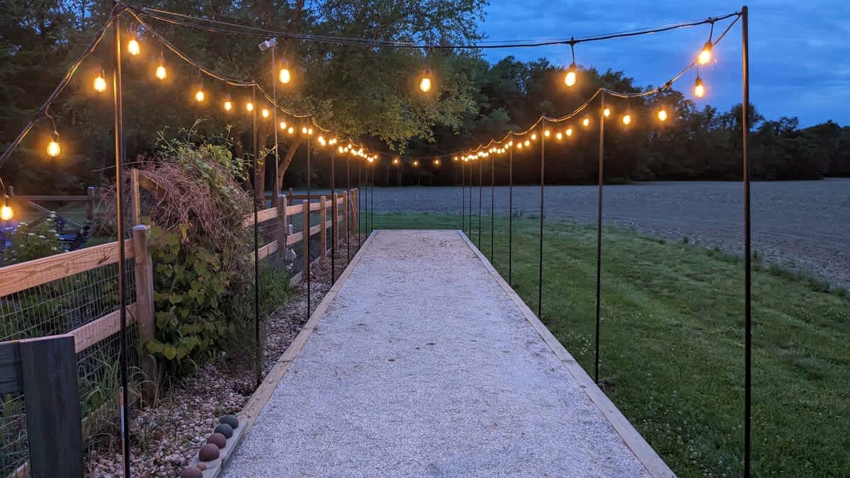 Evening bocce under twinkling lights at Berrywood Farm.