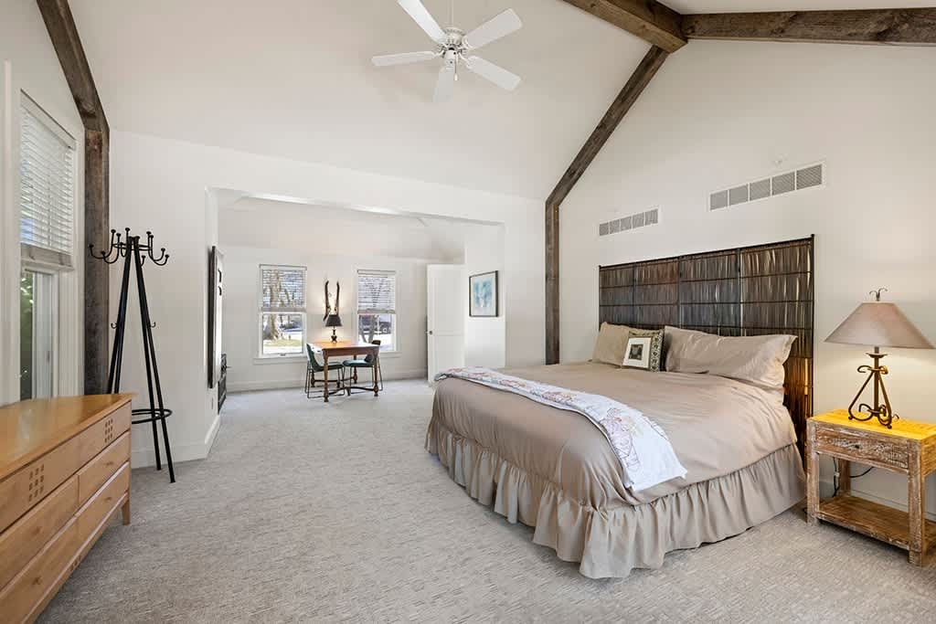 The Farmhouse Primary Bedroom is on the main level and has a king-size bed.