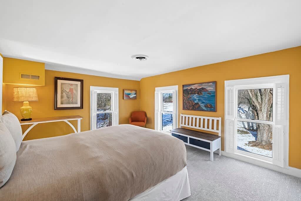 Bedroom 2 in the Farmhouse is on the upper level and has a queen-size bed.