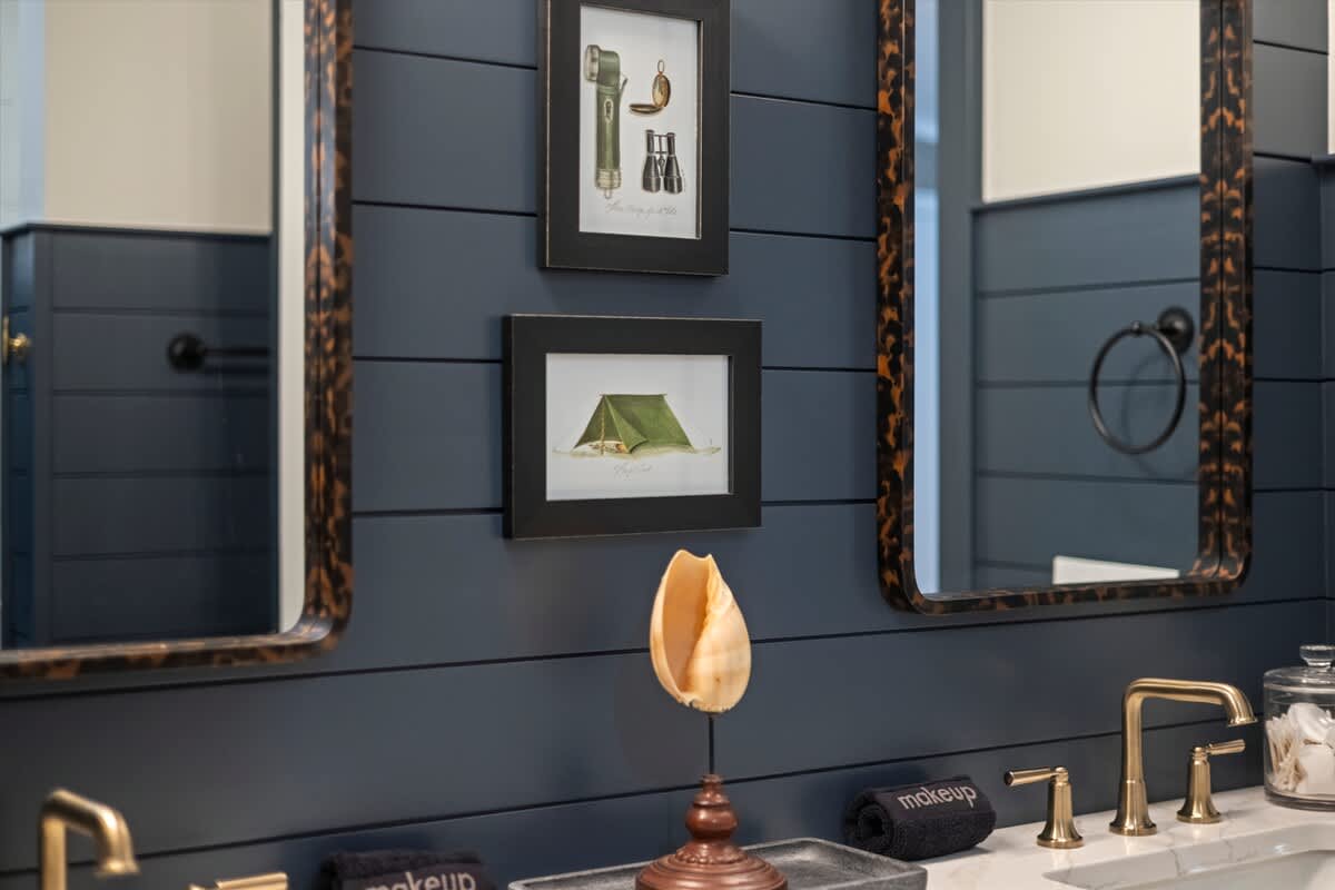 Nautical tones and vintage touches define this inviting bath.
