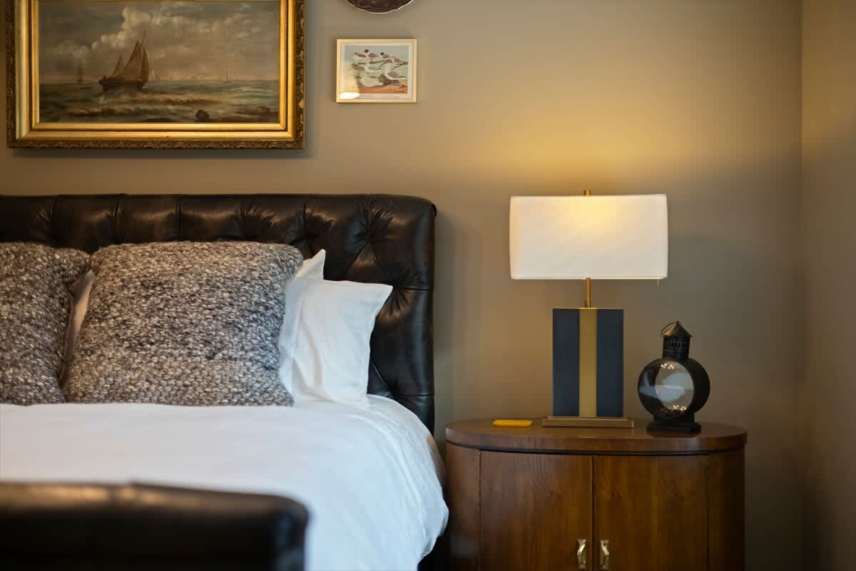 A thoughtfully styled bedside scene in the main bedroom.