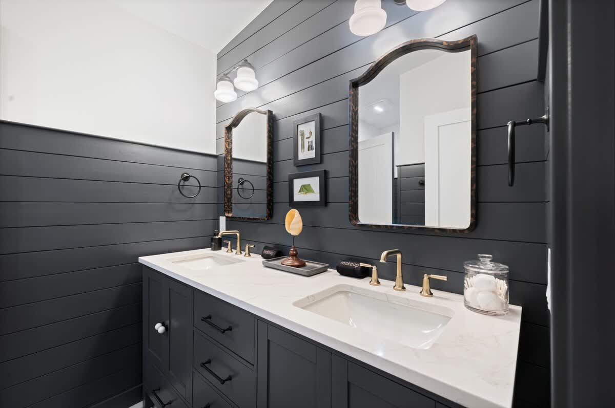 The Woodsmen’s bath blends timeless detail with calm symmetry.