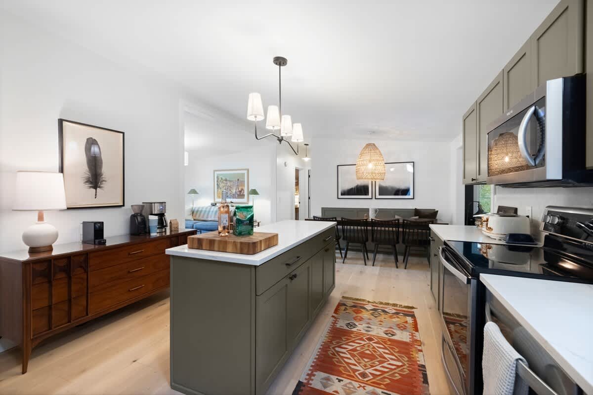 The kitchen opens to dining, creating space for effortless gathering.