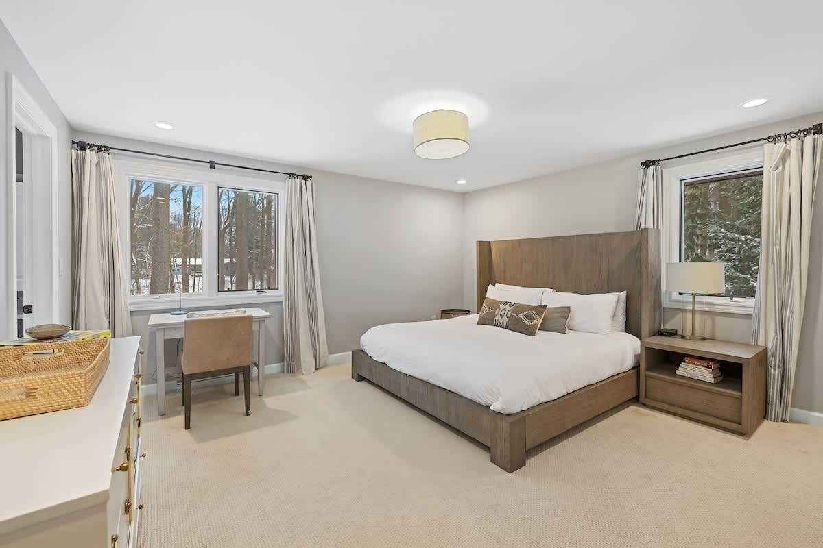 The primary bedroom is on the upper level and has a king-size bed + air mattress.