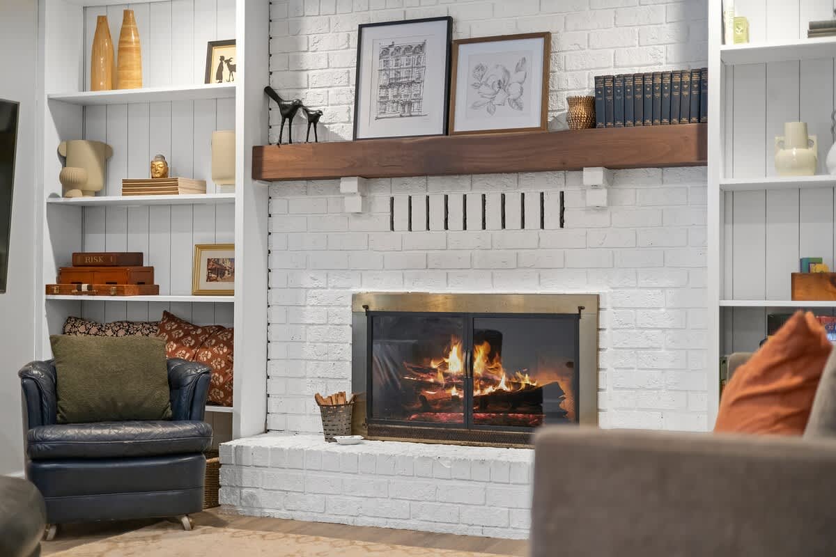 A firelit corner perfect for cards, books, and laughter.