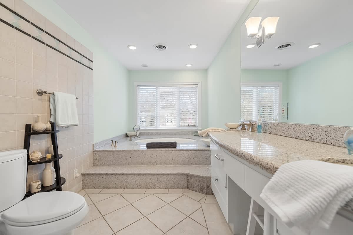 Take your time getting ready in a bright, spa-like bath.
