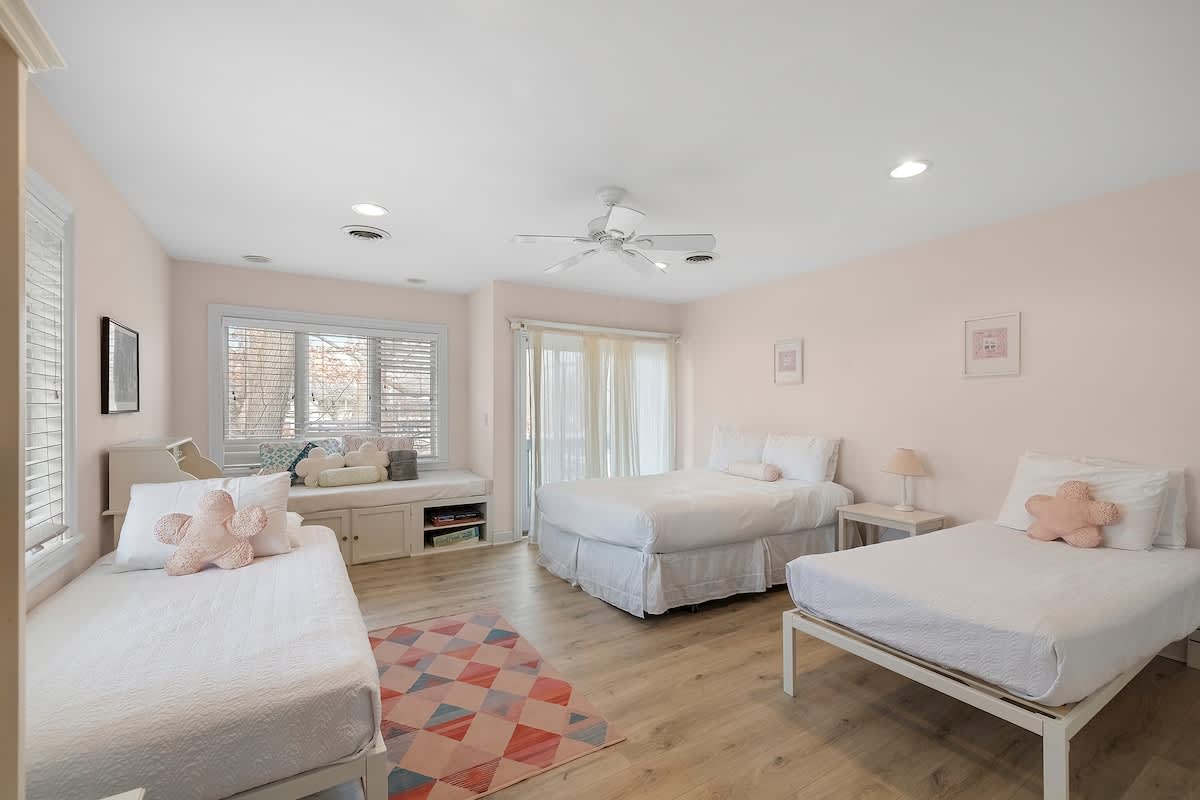 Bedroom 4 is on the upper level and has 1 queen and 2 single beds.