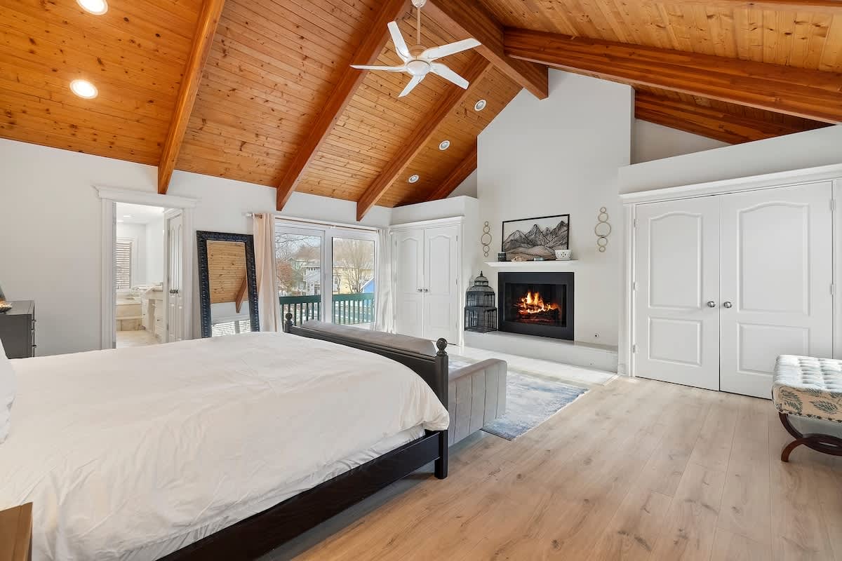 Wake slowly with soft morning light in the signature suite (fireplace not available for guest use).
