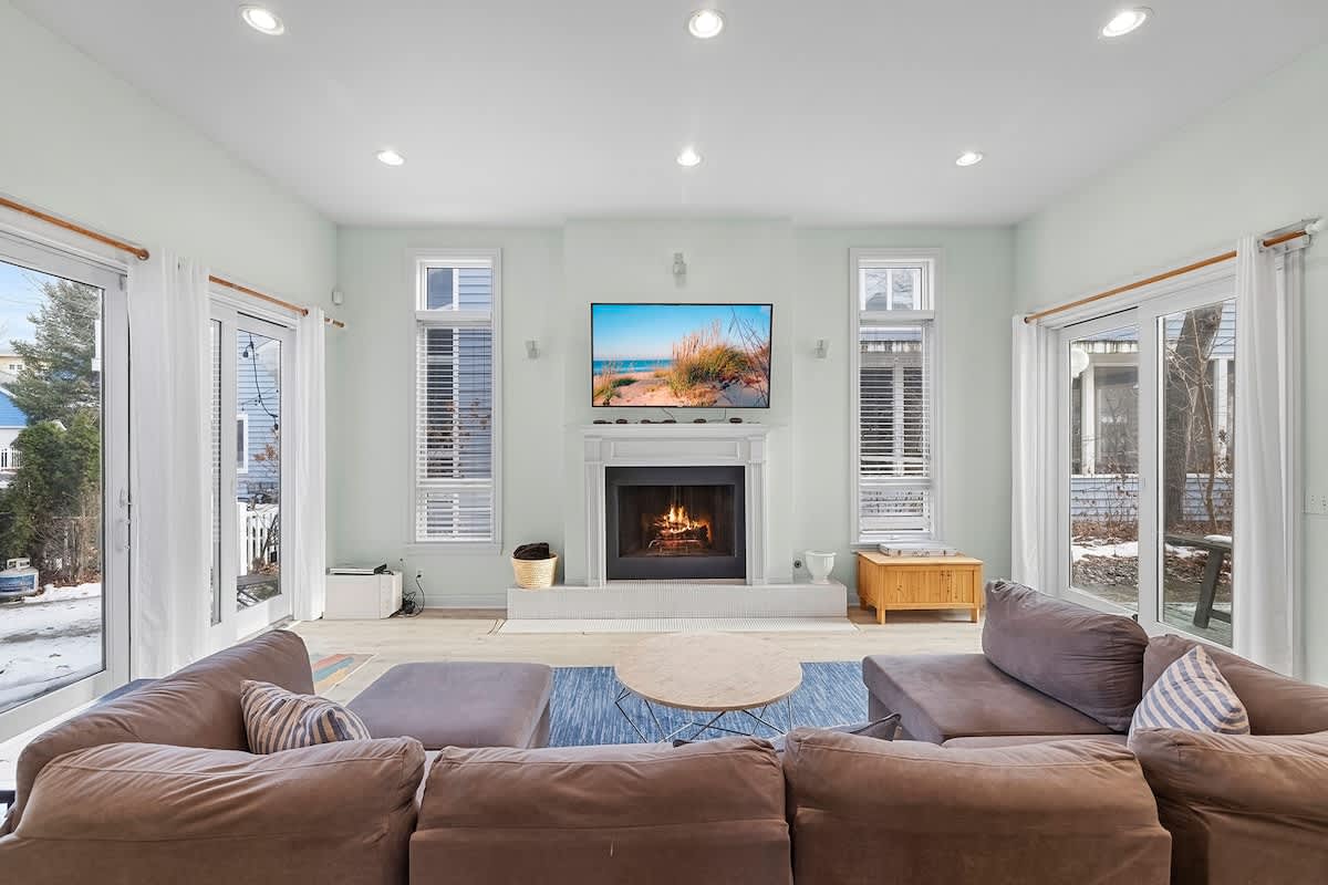 A second welcoming living room where movie nights family chats unfold. (fireplace not available for guest use)