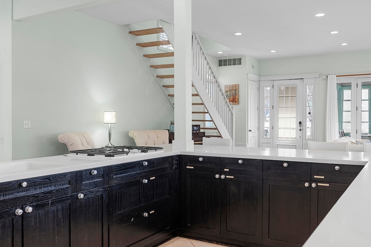 A generous kitchen where cooking stays social and everything flows.