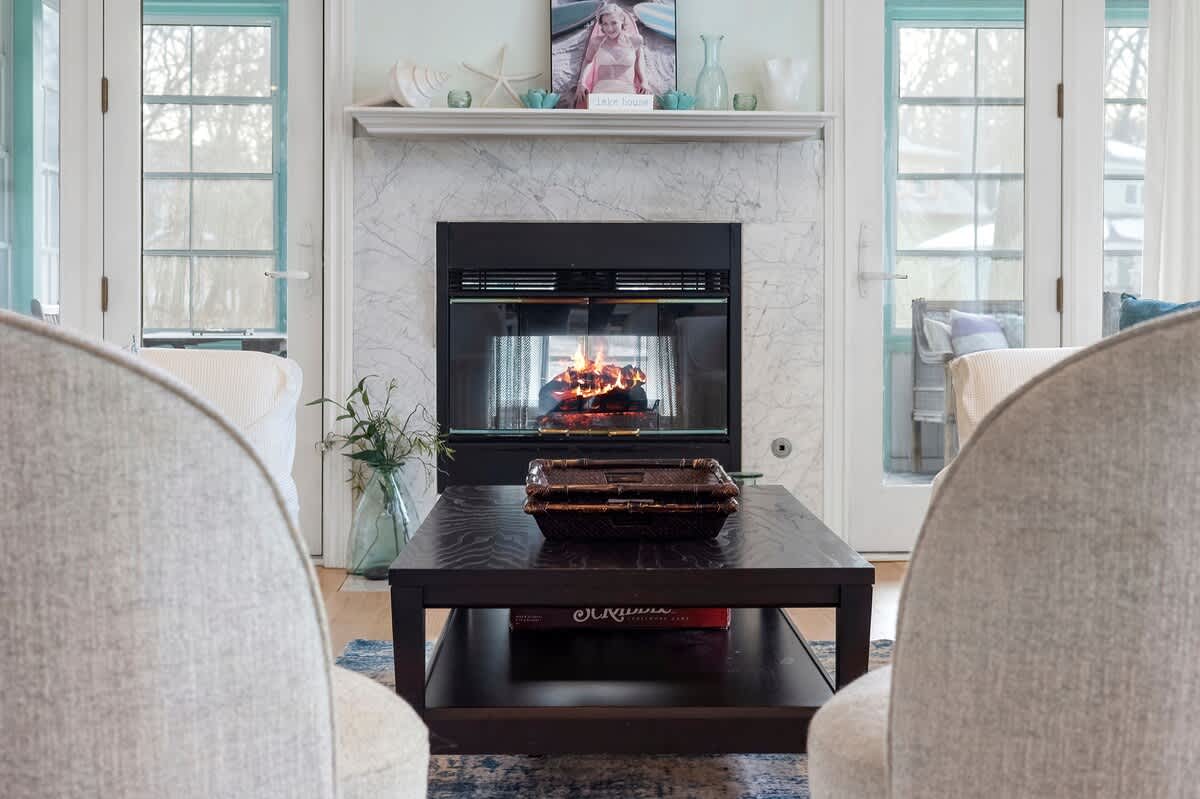 Main living area with coastal decor creates the perfect retreat (fireplace not available for guest use).